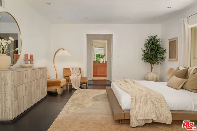 a house view with a sitting space and garden space