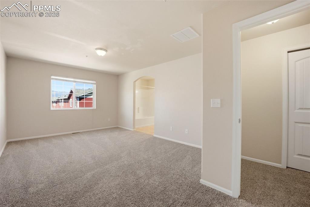 3019 Shikra View Colorado Springs, CO 80916 - Photo 13 of 42 an empty room with windows