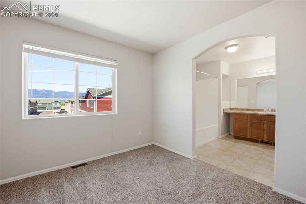 3019 Shikra View Colorado Springs, CO 80916 - Photo 15 of 42 a view of an empty room with a window