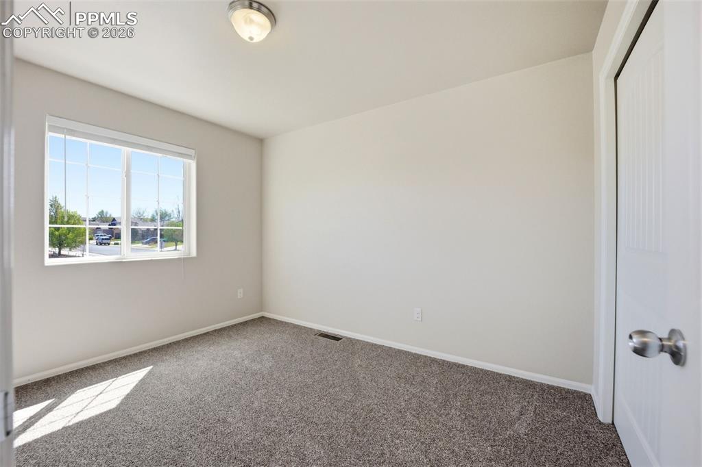 3019 Shikra View Colorado Springs, CO 80916 - Photo 25 of 42 an empty room with windows