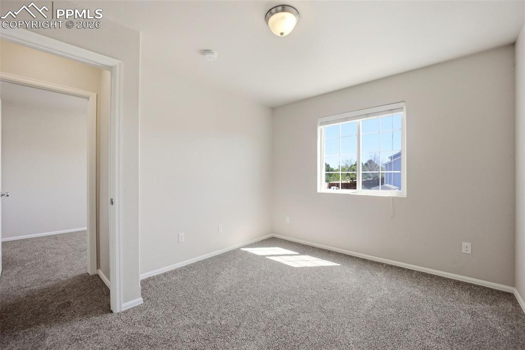 3019 Shikra View Colorado Springs, CO 80916 - Photo 27 of 42 an empty room with windows