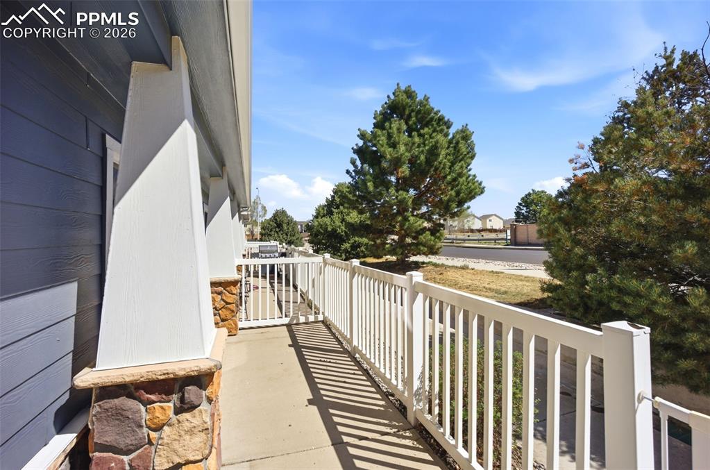 3019 Shikra View Colorado Springs, CO 80916 - Photo 3 of 42 a view of balcony with wooden floor and fence