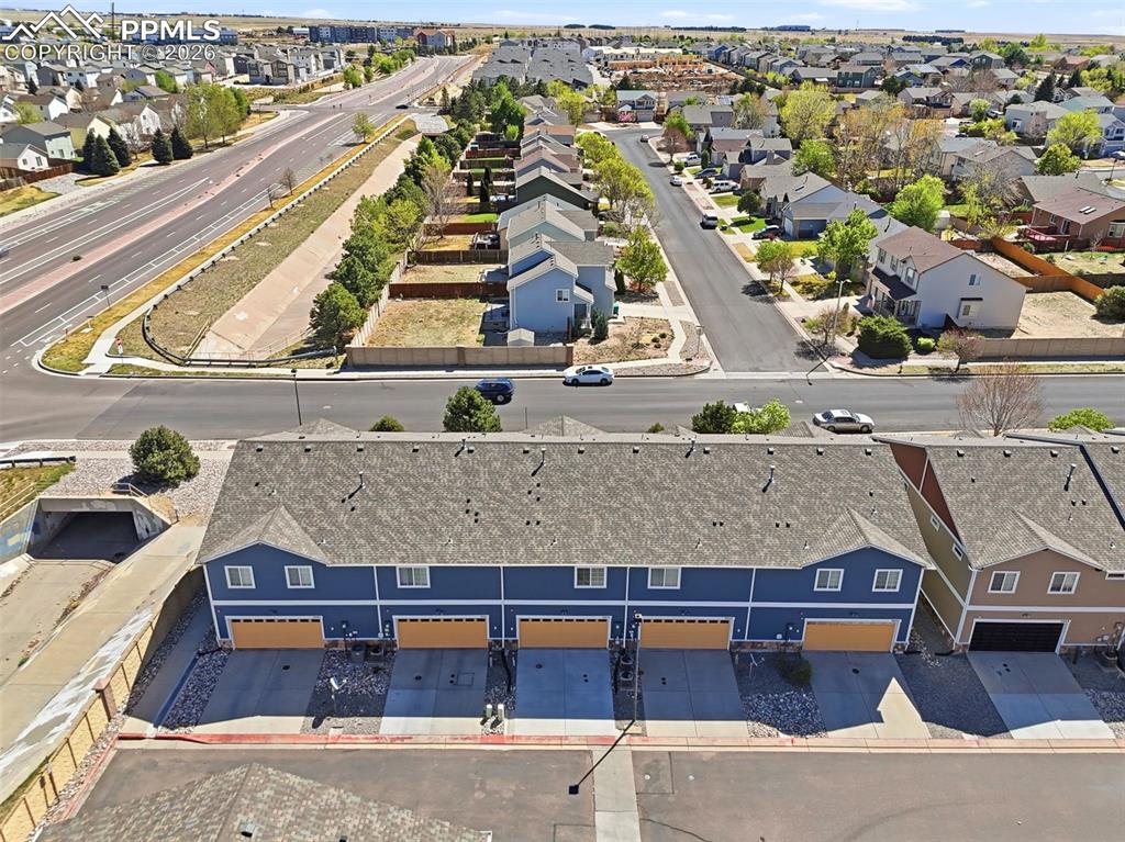 3019 Shikra View Colorado Springs, CO 80916 - Photo 38 of 42 an aerial view of residential houses with outdoor space and parking
