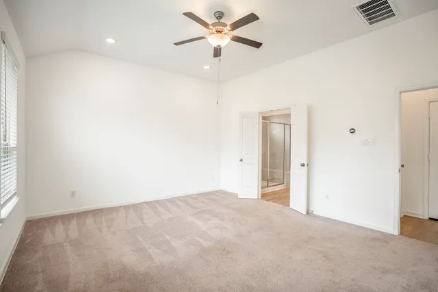 a spacious bathroom with a shower and a sink
