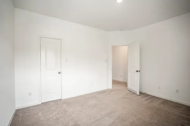 a view of a house with yard and sitting area