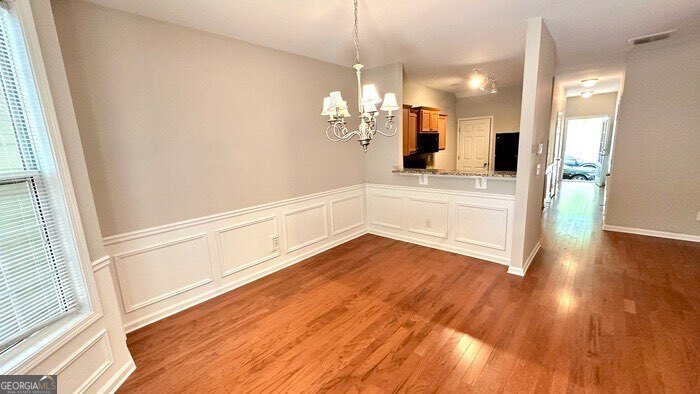 879 Langston Trace Stone Mountain, GA 30083 - Photo 11 of 16 a view of a hallway with wooden floor