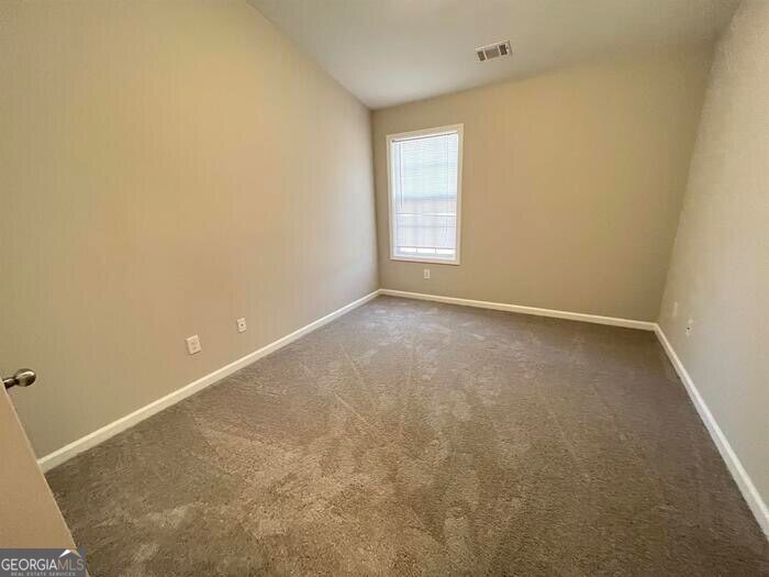 879 Langston Trace Stone Mountain, GA 30083 - Photo 14 of 16 an empty room with windows