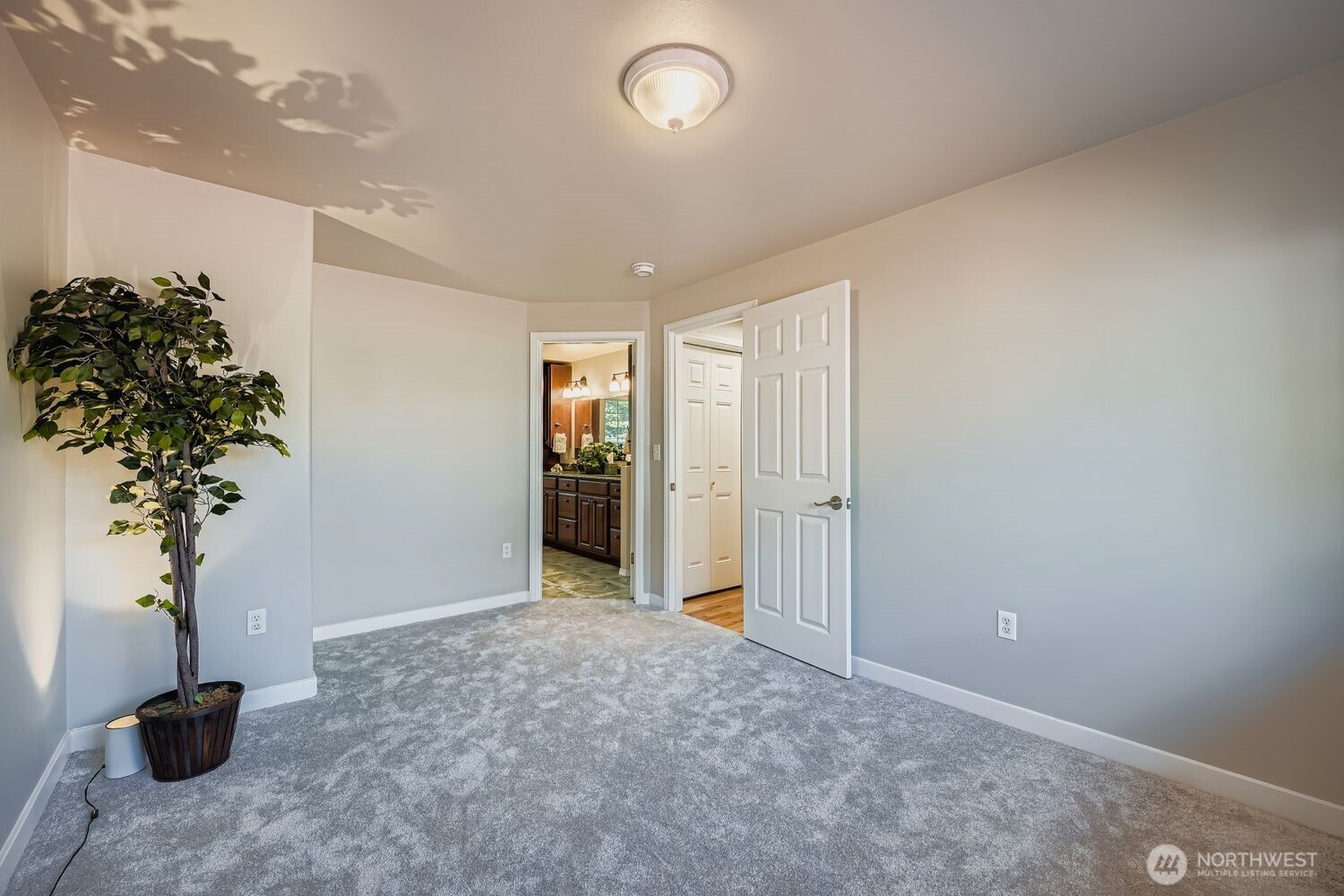 22408 Meridian Avenue South Bothell, WA 98021 - Photo 13 of 28 a view of a livingroom with a potted plant