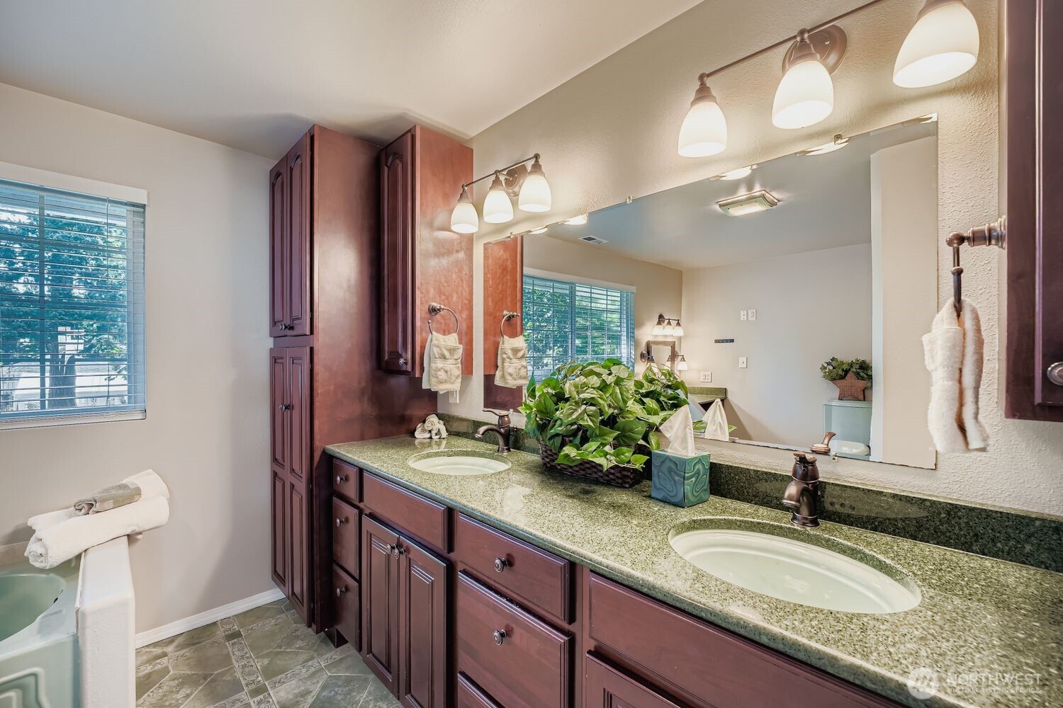 22408 Meridian Avenue South Bothell, WA 98021 - Photo 14 of 28 a bathroom with a granite countertop sink and a mirror
