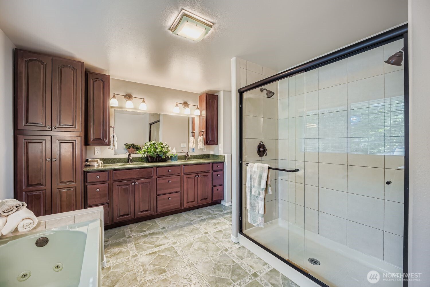 22408 Meridian Avenue South Bothell, WA 98021 - Photo 16 of 28 a bathroom with a tub sink and mirror