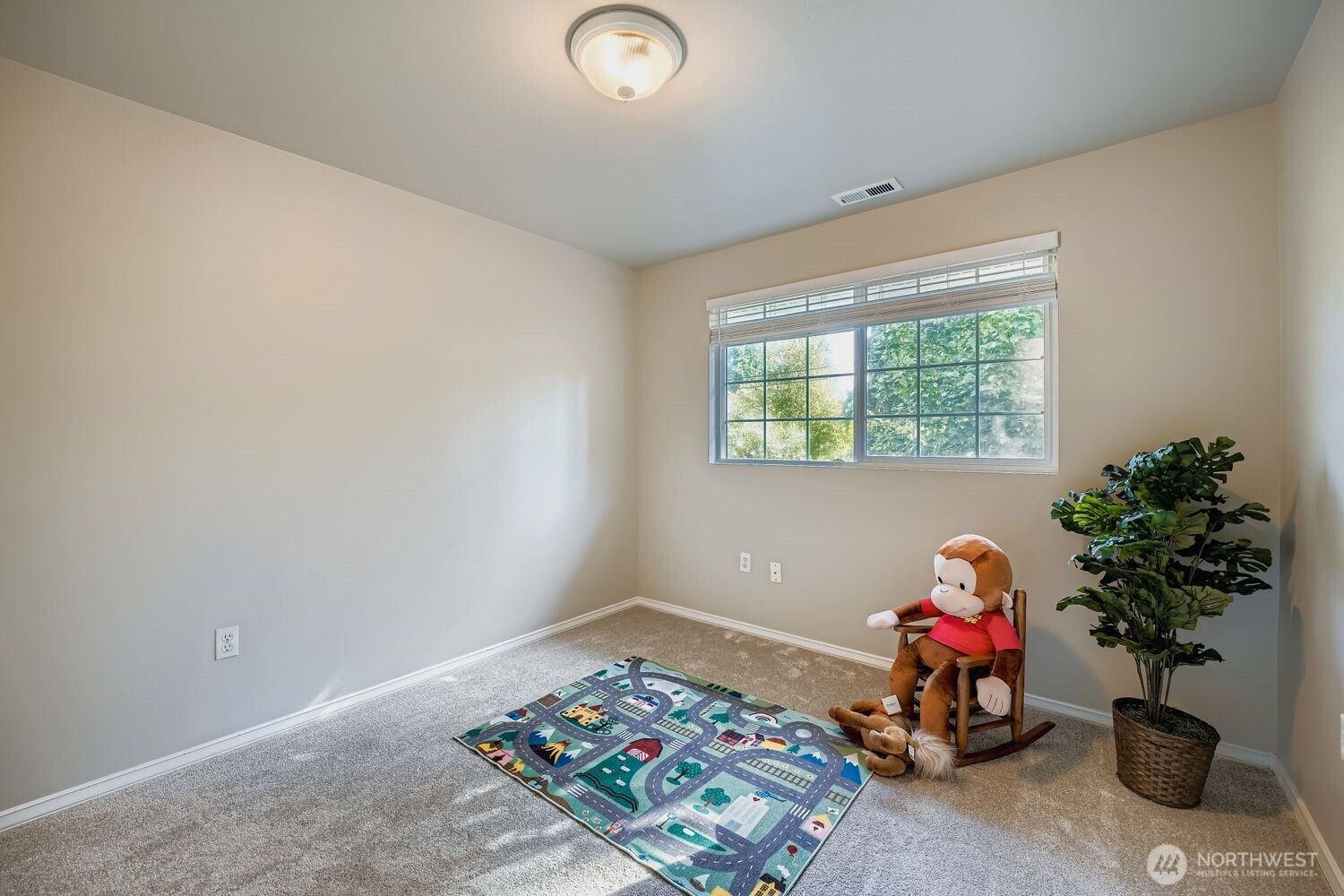22408 Meridian Avenue South Bothell, WA 98021 - Photo 18 of 28 a bedroom with a bed and a potted plant