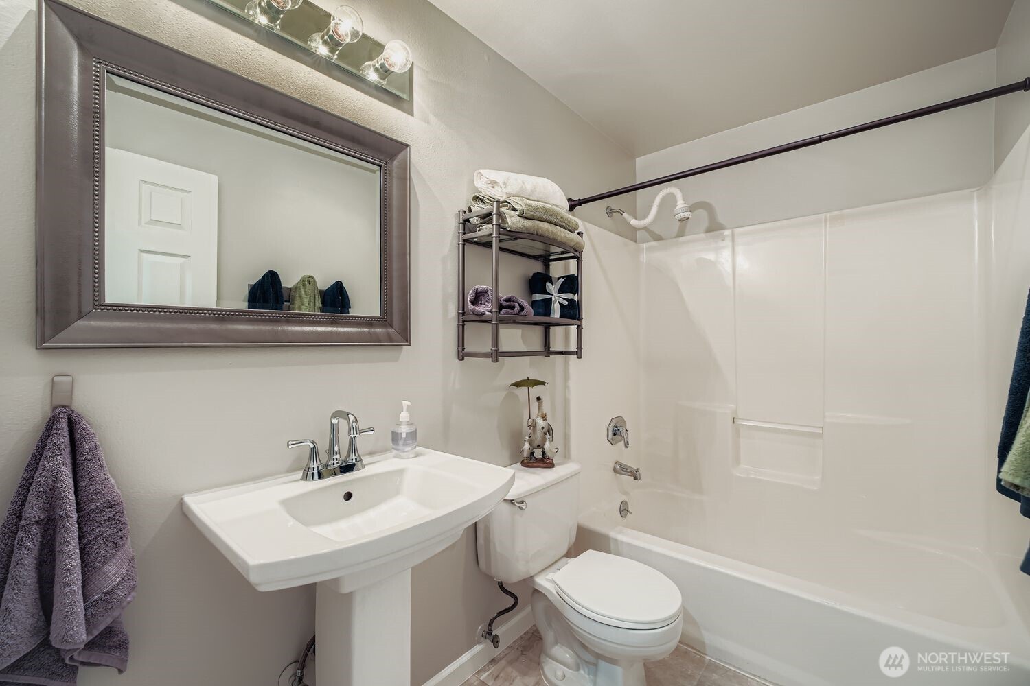 22408 Meridian Avenue South Bothell, WA 98021 - Photo 19 of 28 a bathroom with a sink a toilet and shower