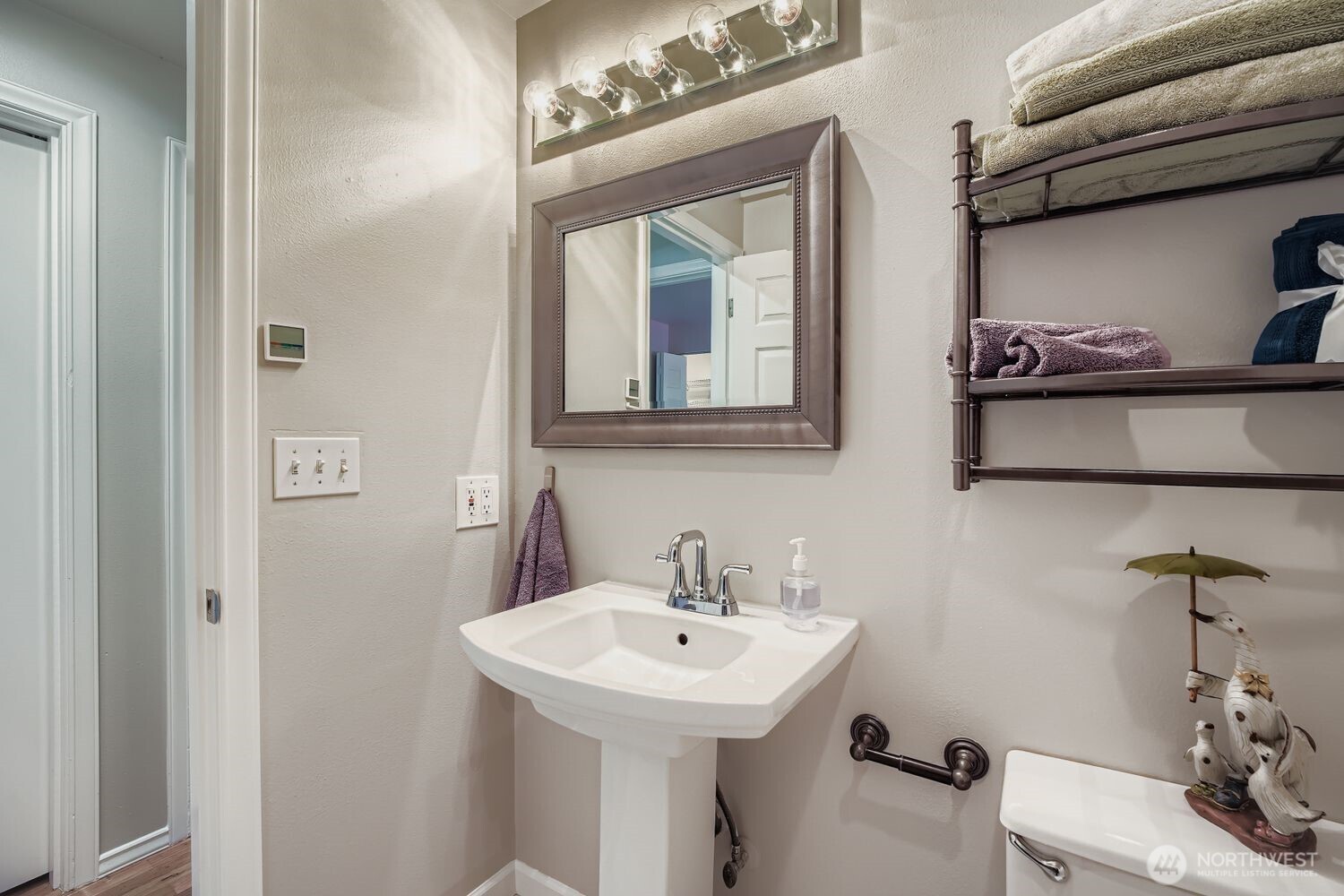 22408 Meridian Avenue South Bothell, WA 98021 - Photo 20 of 28 a bathroom with a sink and a mirror