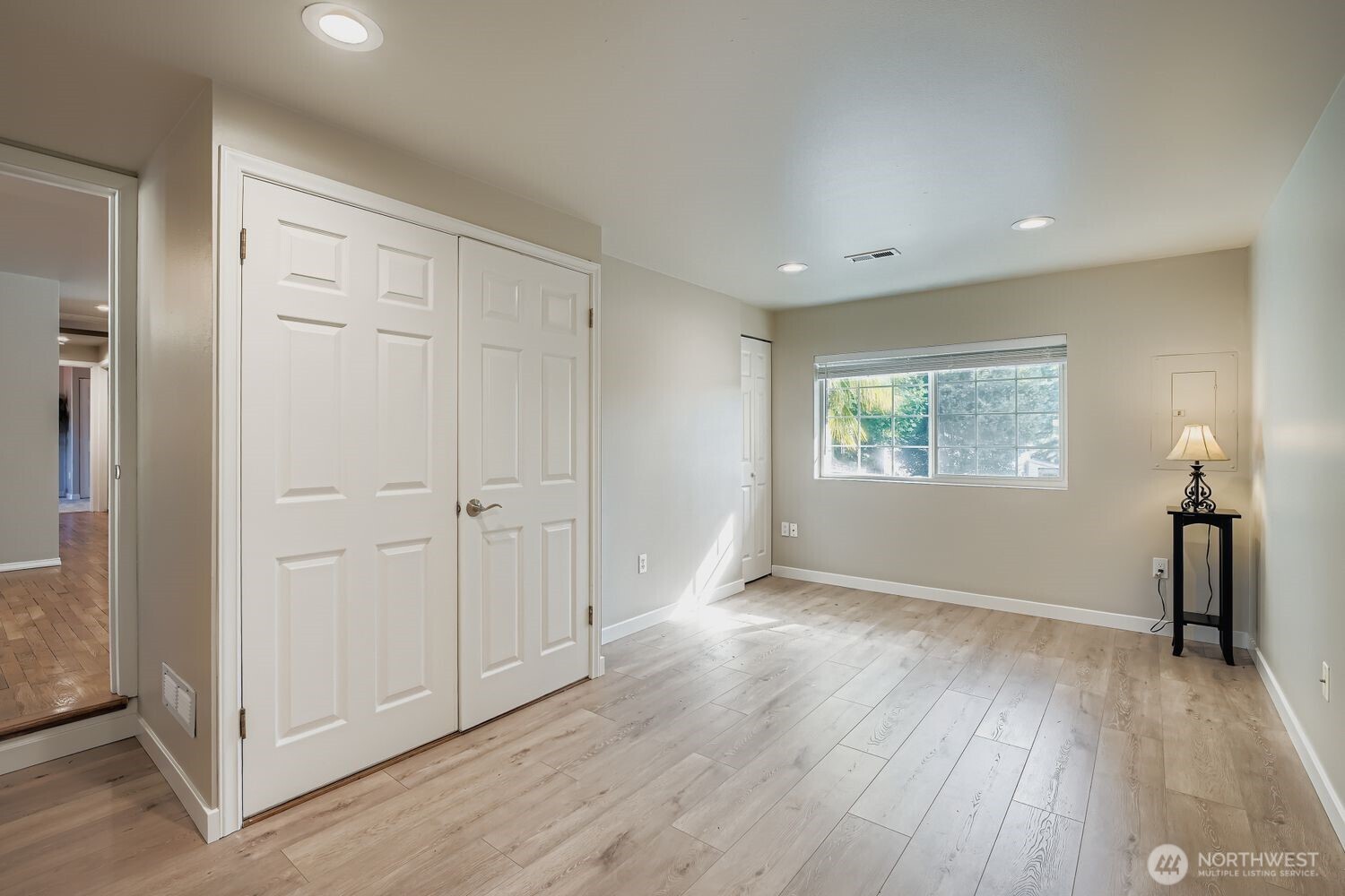 22408 Meridian Avenue South Bothell, WA 98021 - Photo 21 of 28 an empty room with wooden floor cabinet and windows