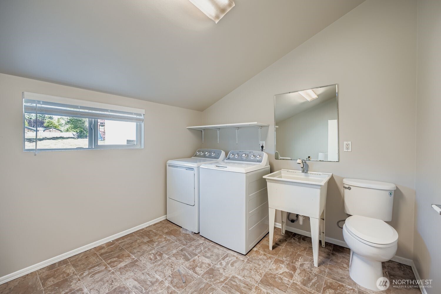 22408 Meridian Avenue South Bothell, WA 98021 - Photo 23 of 28 a bathroom with a toilet sink and mirror