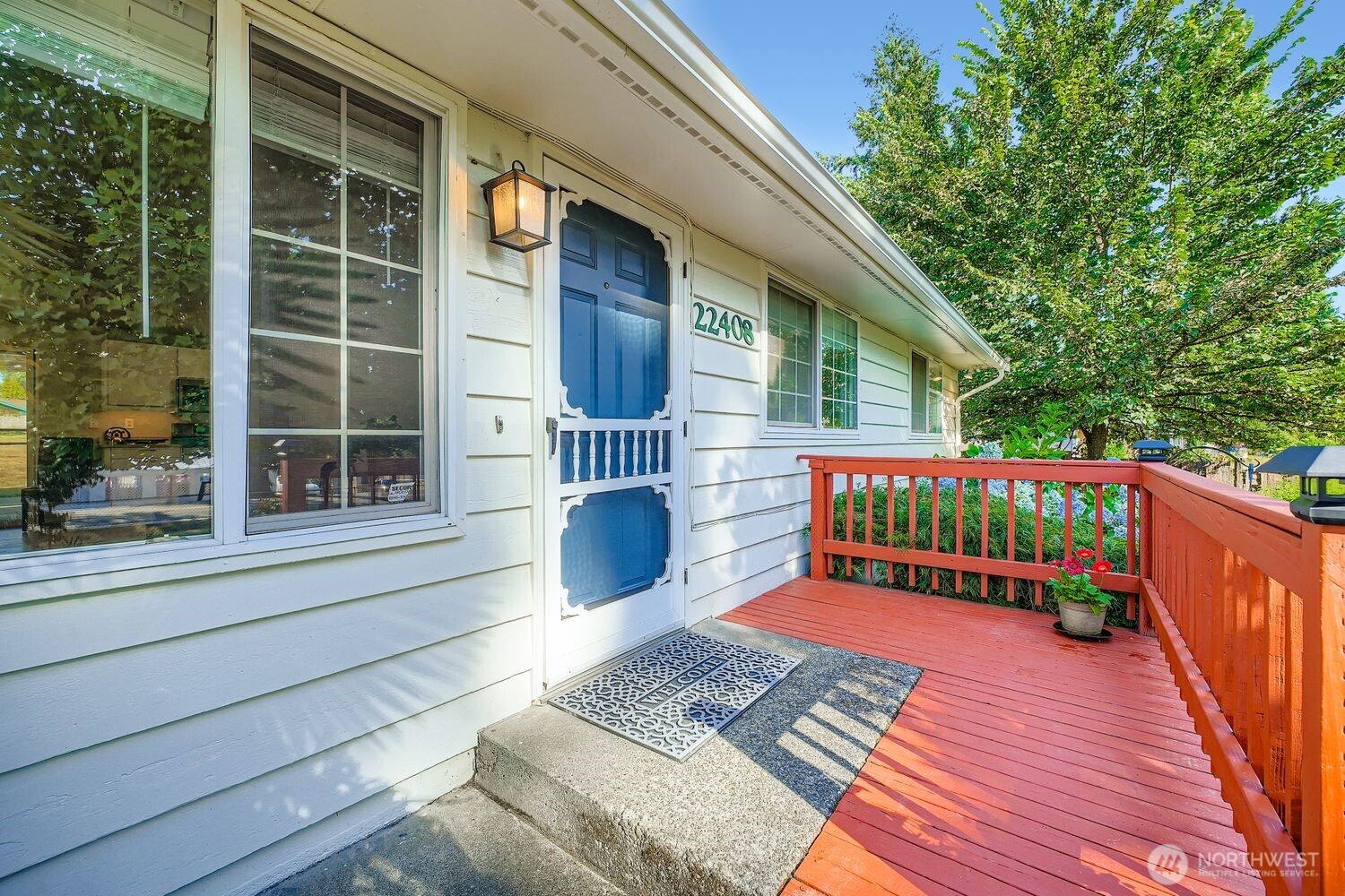 22408 Meridian Avenue South Bothell, WA 98021 - Photo 3 of 28 a balcony with a potted plant and two windows