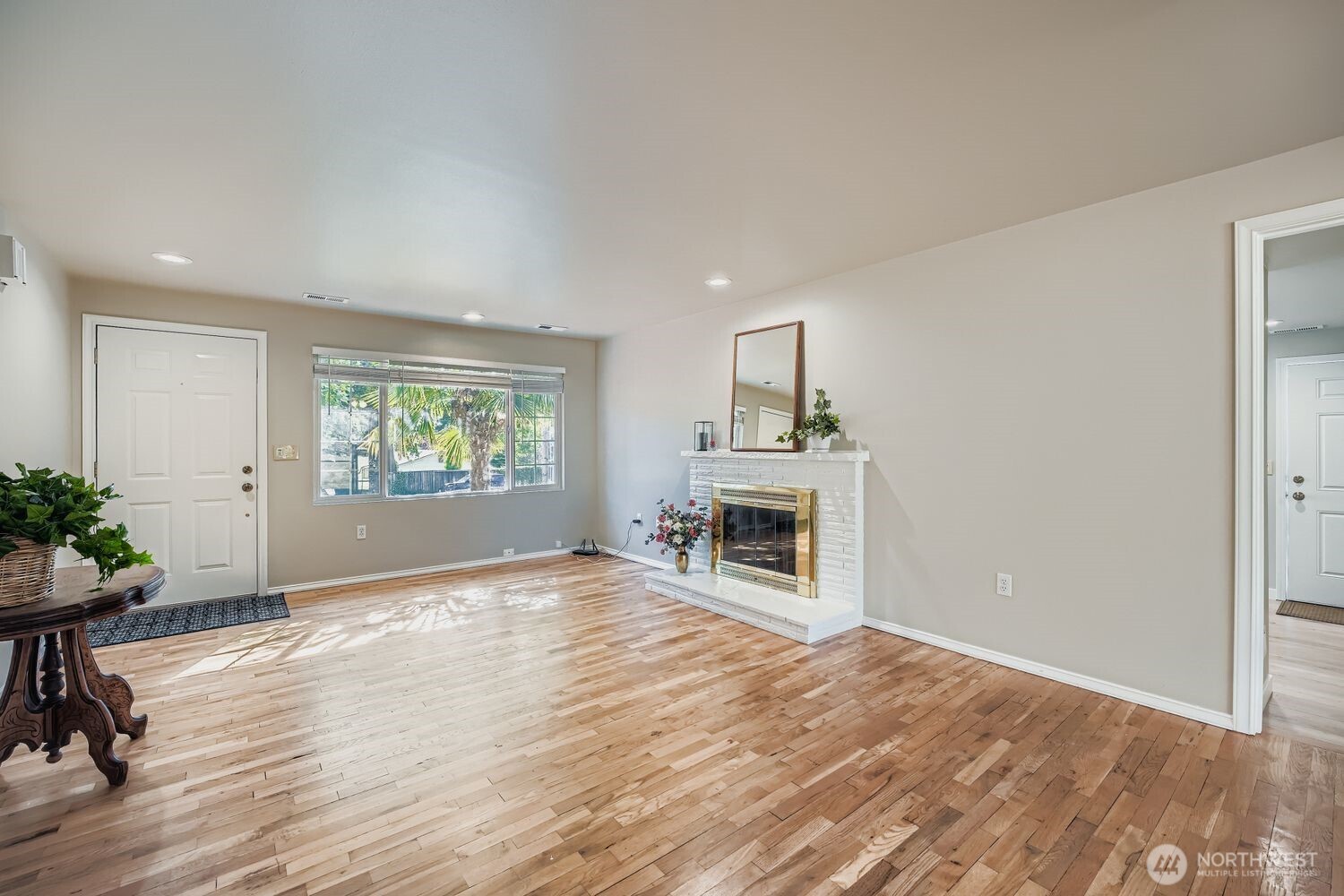 22408 Meridian Avenue South Bothell, WA 98021 - Photo 5 of 28 an empty room with wooden floor and windows