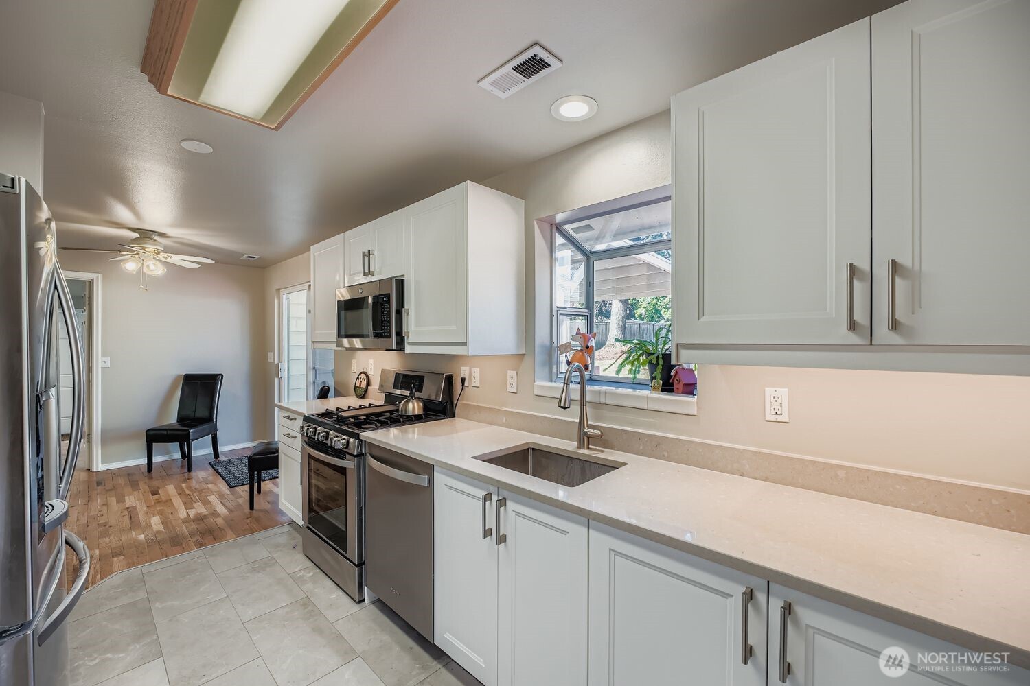 22408 Meridian Avenue South Bothell, WA 98021 - Photo 9 of 28 a kitchen that has a sink and a stove in it