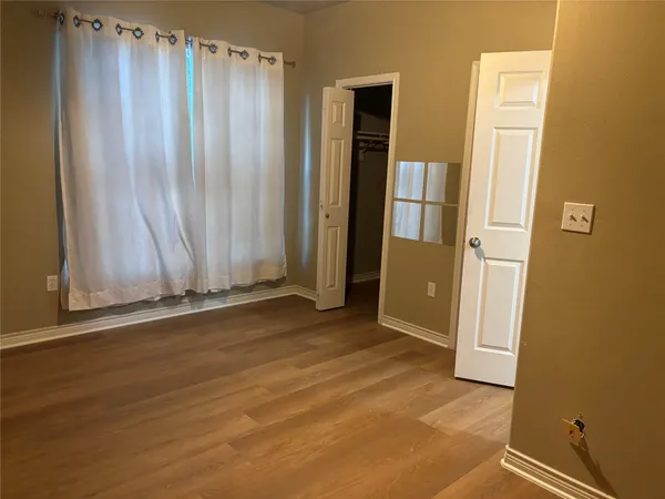 a view of a garage with furniture and a door