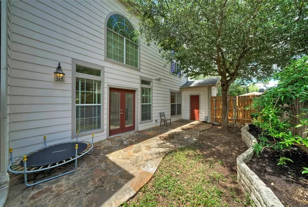 a view of a house with backyard and porch