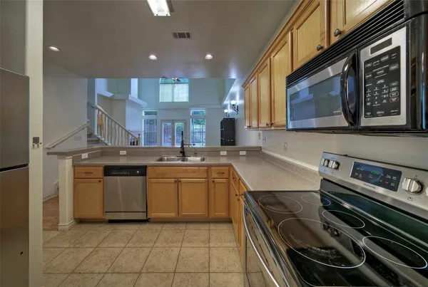 a kitchen with a stove and a sink