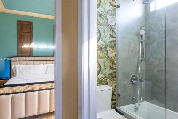 a bathroom with a shower and a sink