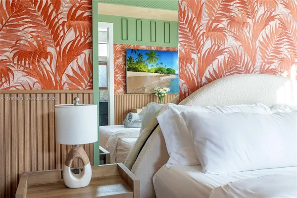 a balcony with table and chairs