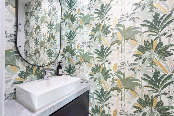 a bathroom with a sink and mirror