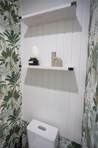 a bathroom with a toilet and sink