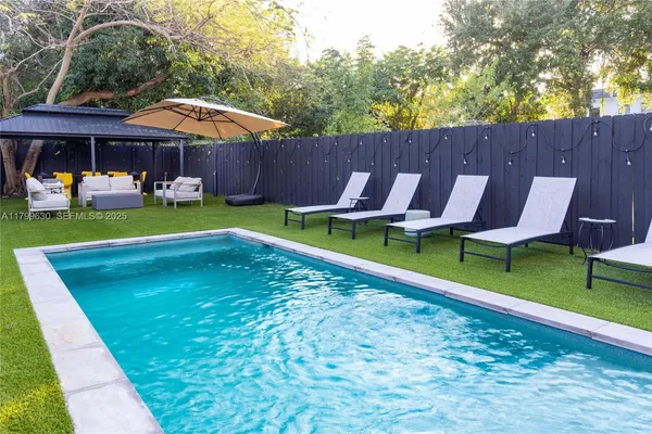 a view of a patio with swimming pool