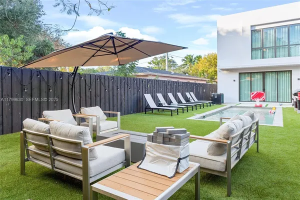 a view of yard with outdoor seating