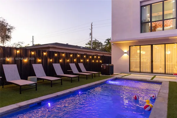 a bedroom with a large bed and a large window
