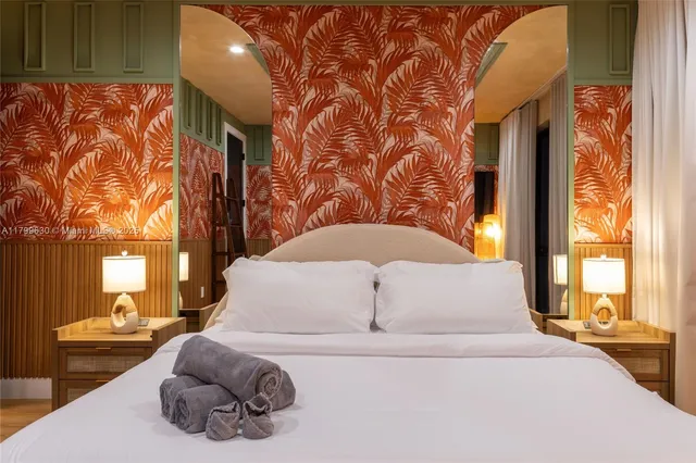 a view of a bathroom with a sink and a mirror