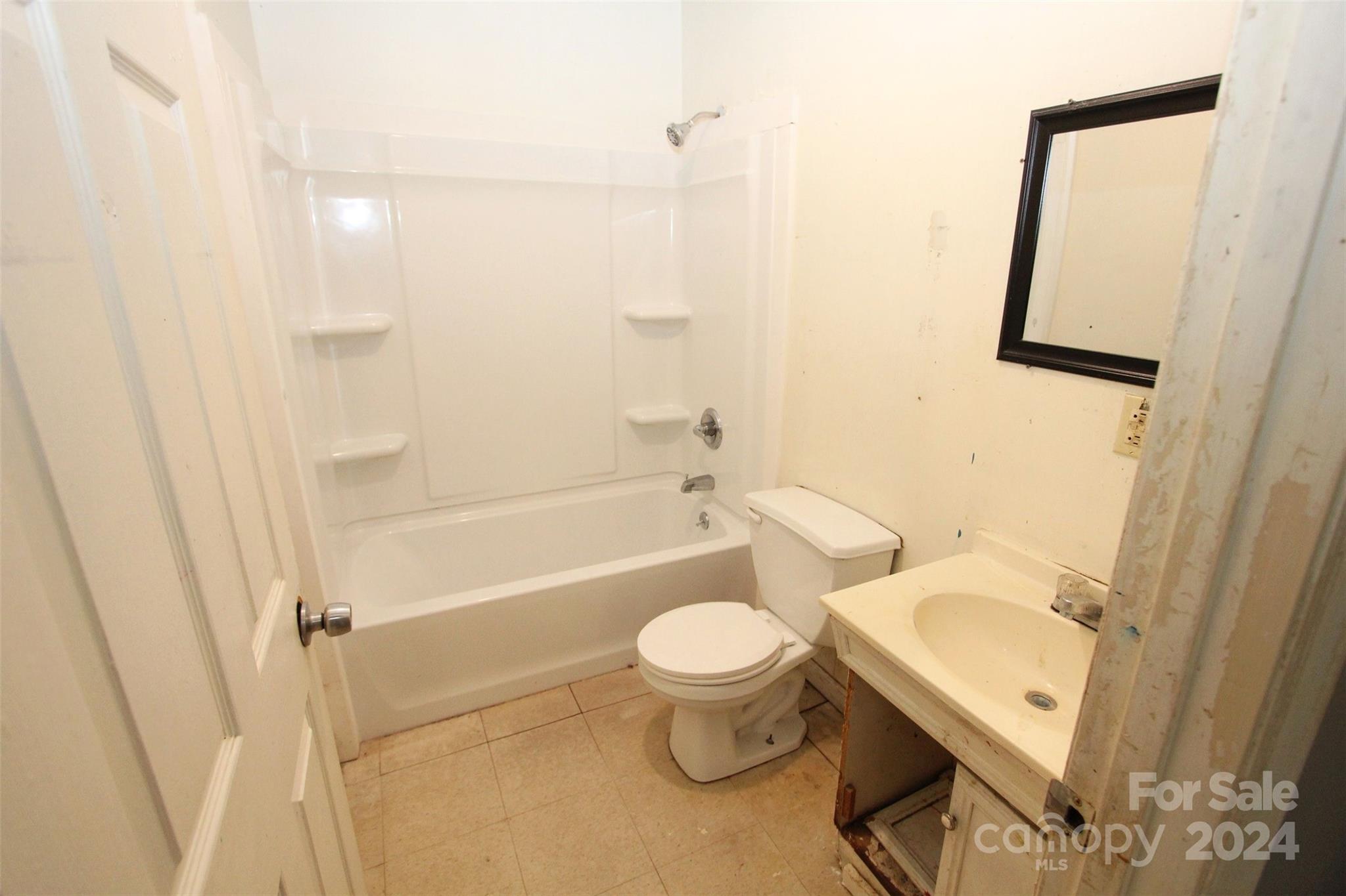 301 Rosehaven Road Morven, NC 28119 - Photo 25 of 36 a bathroom with a sink toilet and shower