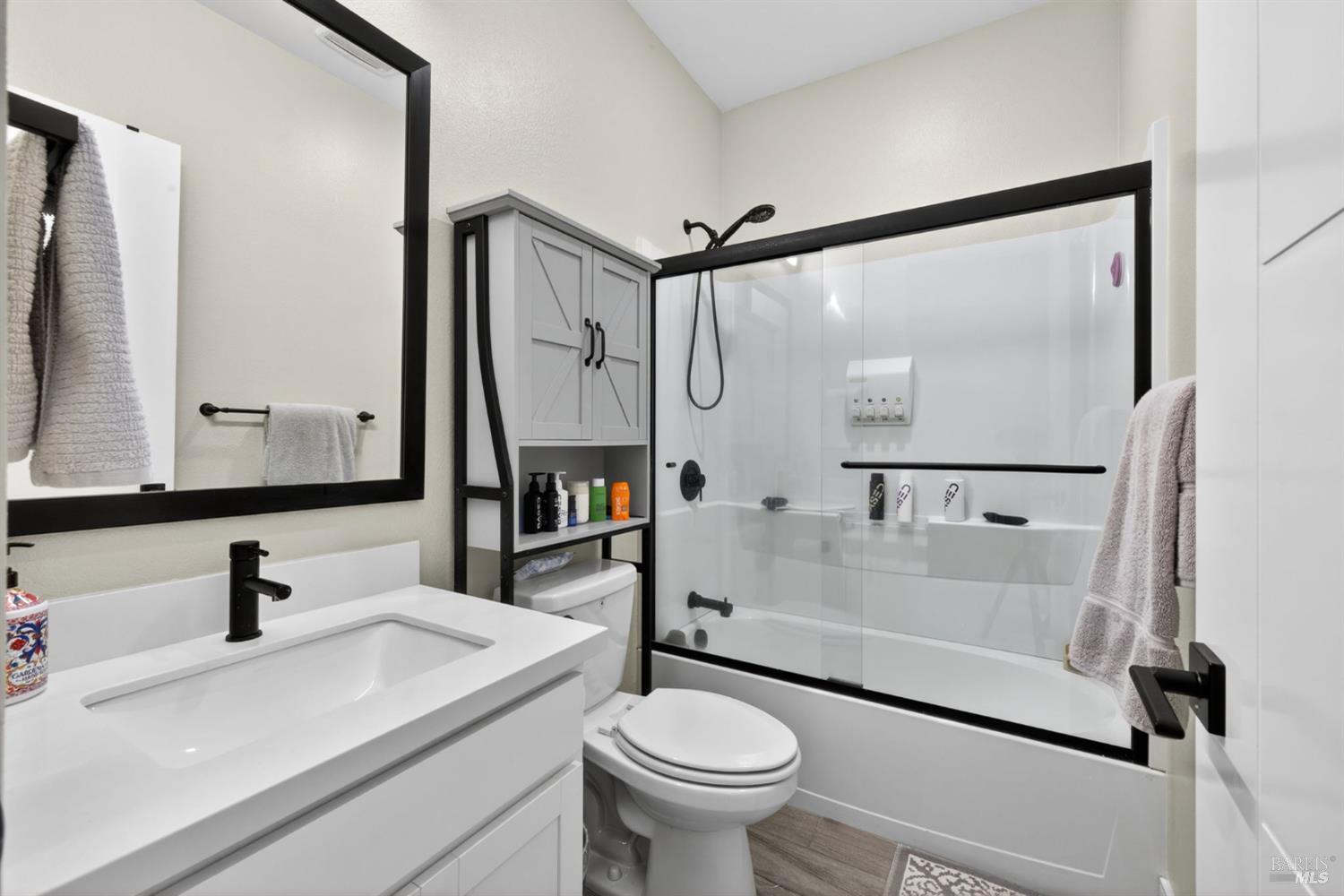 2215-2217 Versaro Drive Santa Rosa, CA 95403 - Photo 26 of 45 a bathroom with a sink toilet and shower