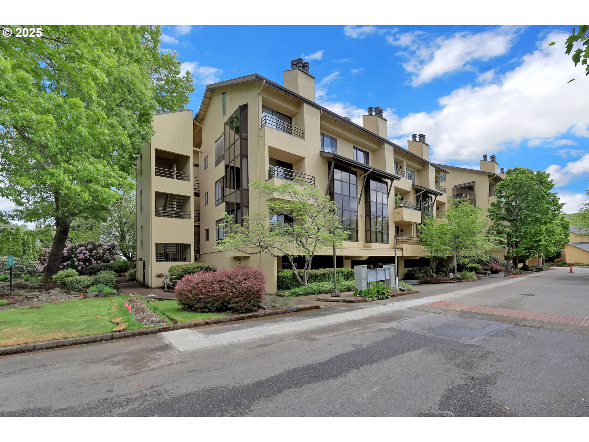 a front view of a building with garden