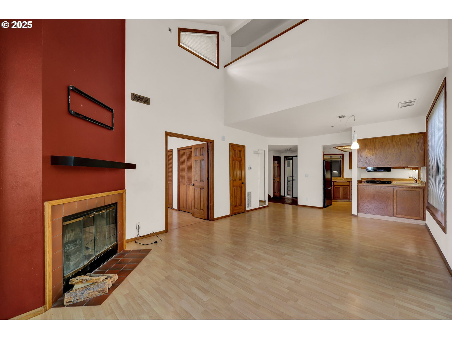 648 Wimbledon Court Eugene, OR 97401 - Photo 11 of 45 a view of empty room with wooden floor and fireplace