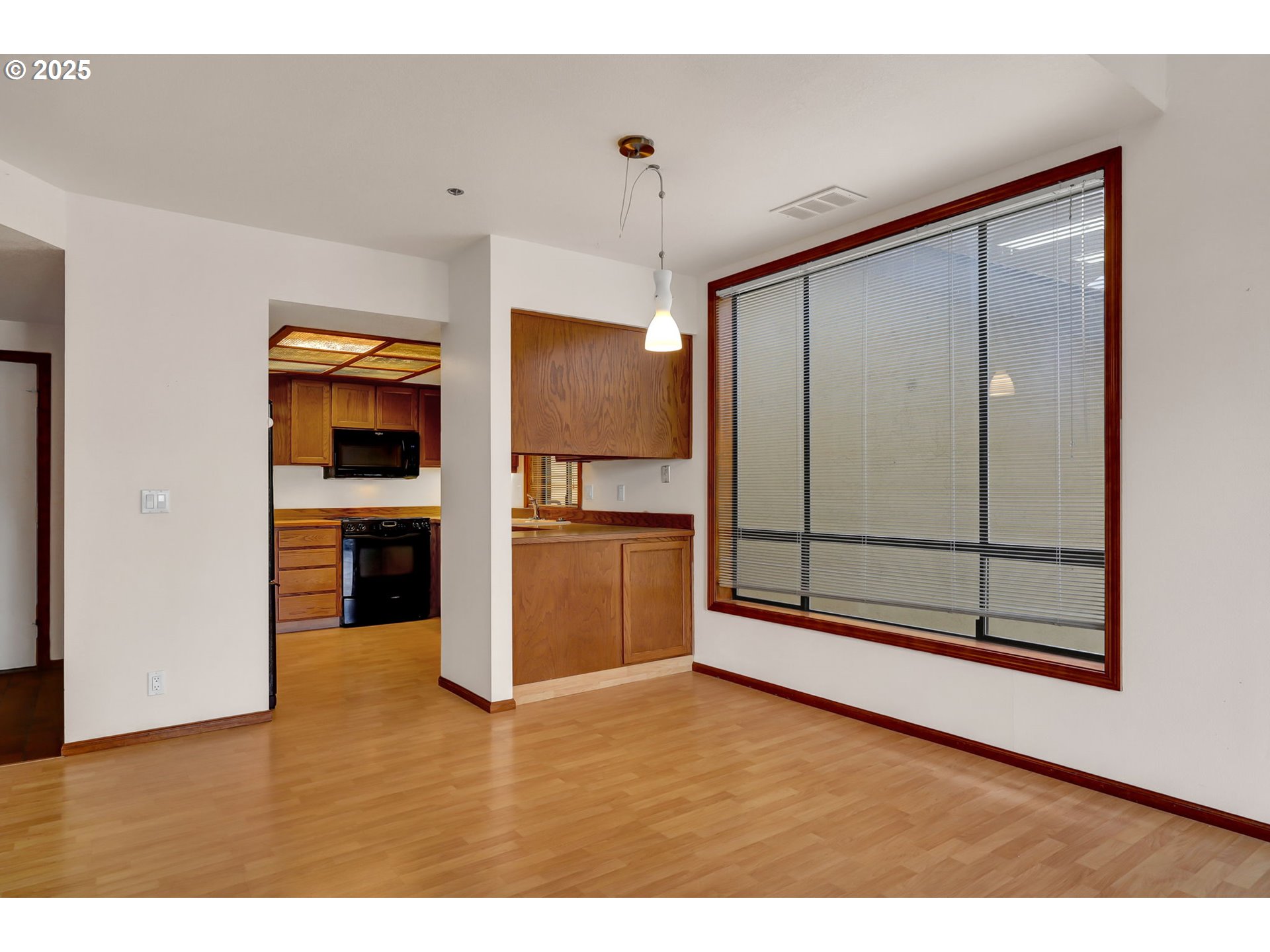 648 Wimbledon Court Eugene, OR 97401 - Photo 13 of 45 a view of a kitchen with wooden floor and electronic appliances