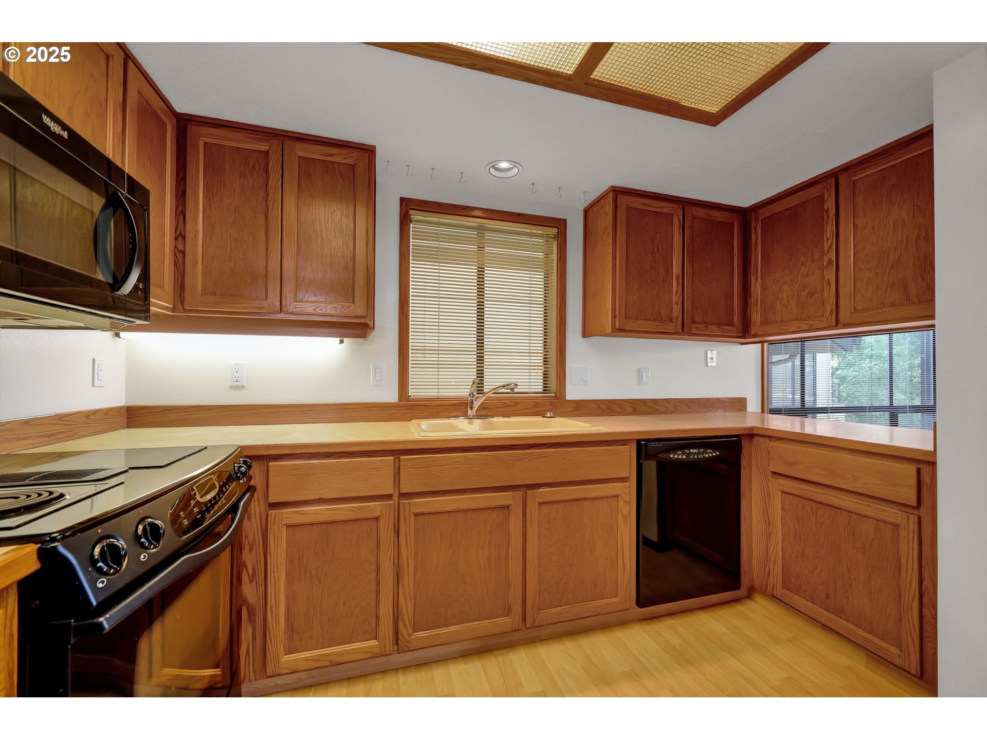 648 Wimbledon Court Eugene, OR 97401 - Photo 19 of 45 a kitchen with stainless steel appliances granite countertop a sink stove and microwave