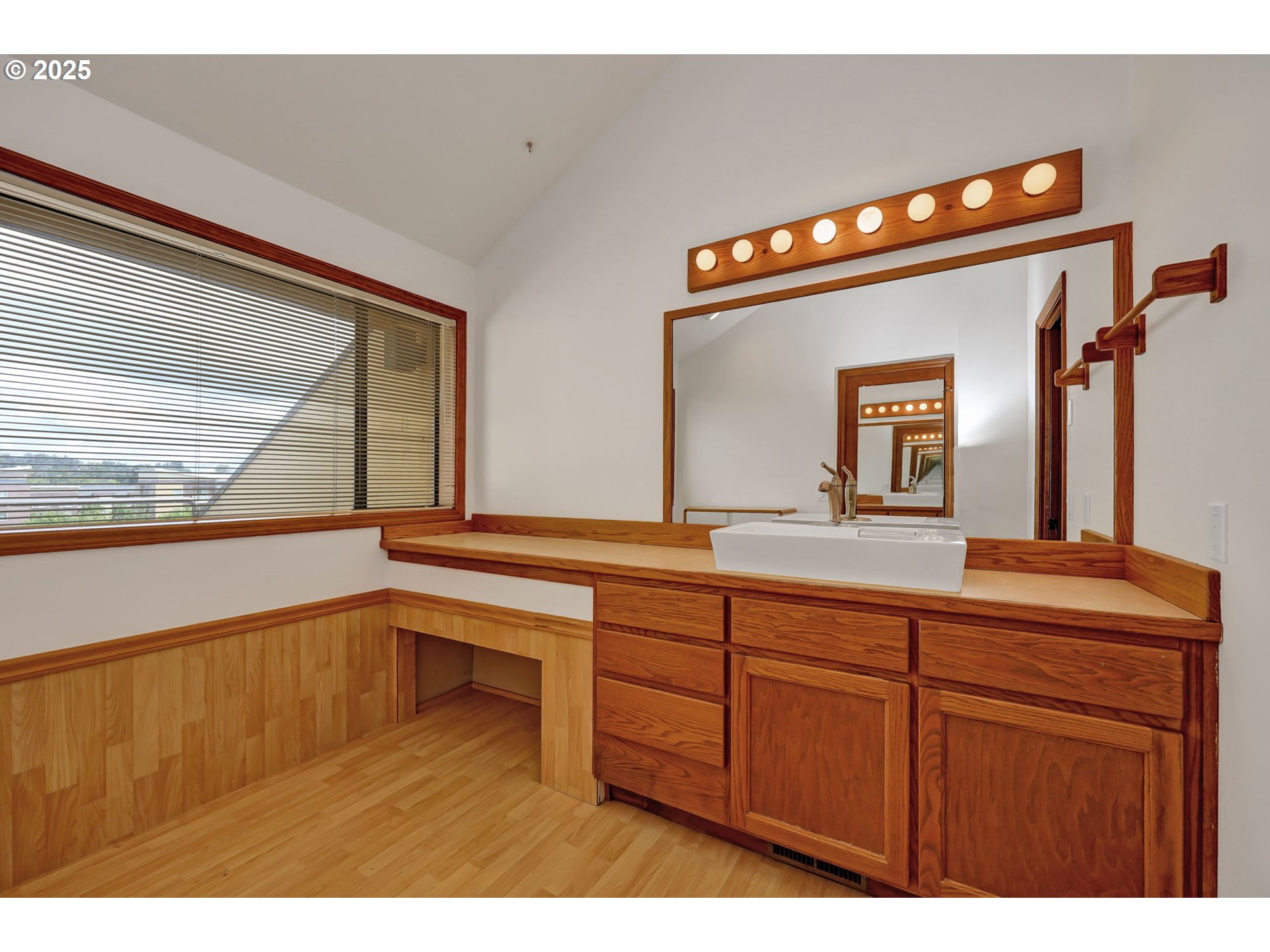 648 Wimbledon Court Eugene, OR 97401 - Photo 28 of 45 a bathroom with a sink and a large mirror