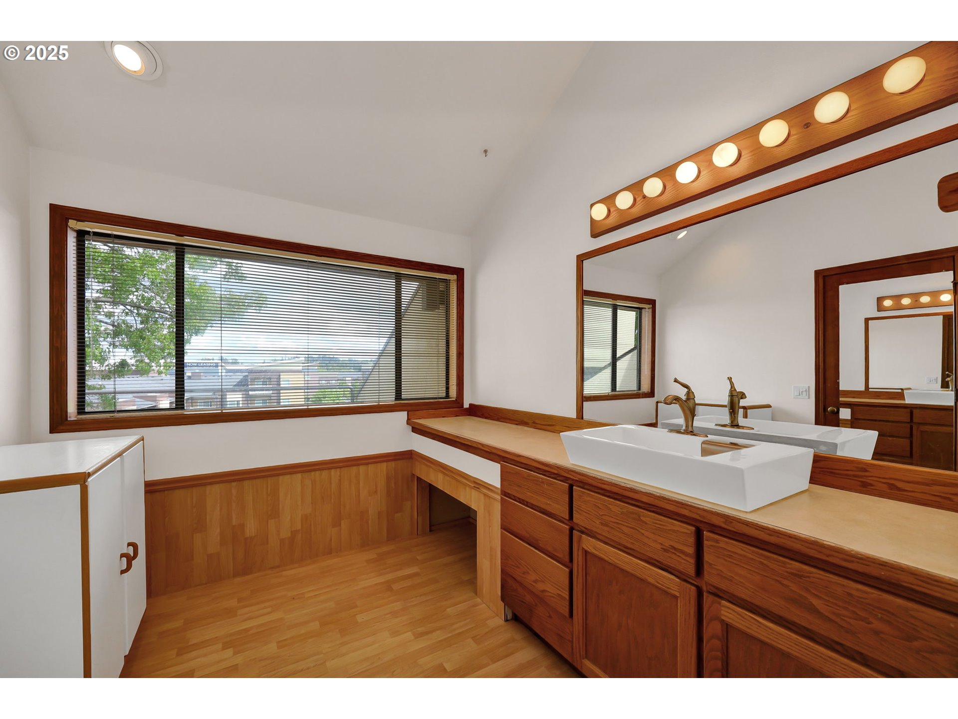 648 Wimbledon Court Eugene, OR 97401 - Photo 30 of 45 a bathroom with a sink and a large mirror