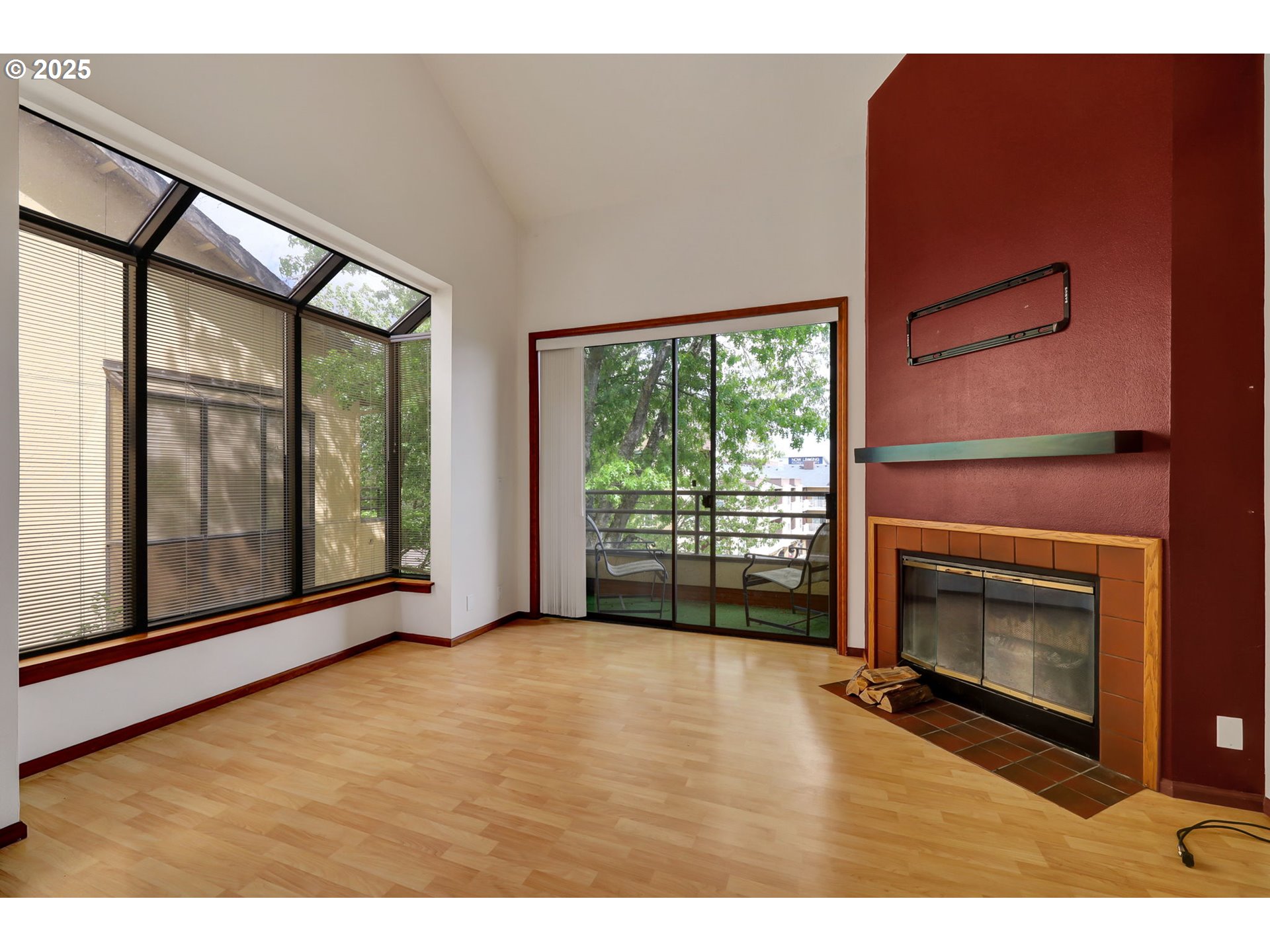 648 Wimbledon Court Eugene, OR 97401 - Photo 8 of 45 a view of an empty room with a fireplace and a window