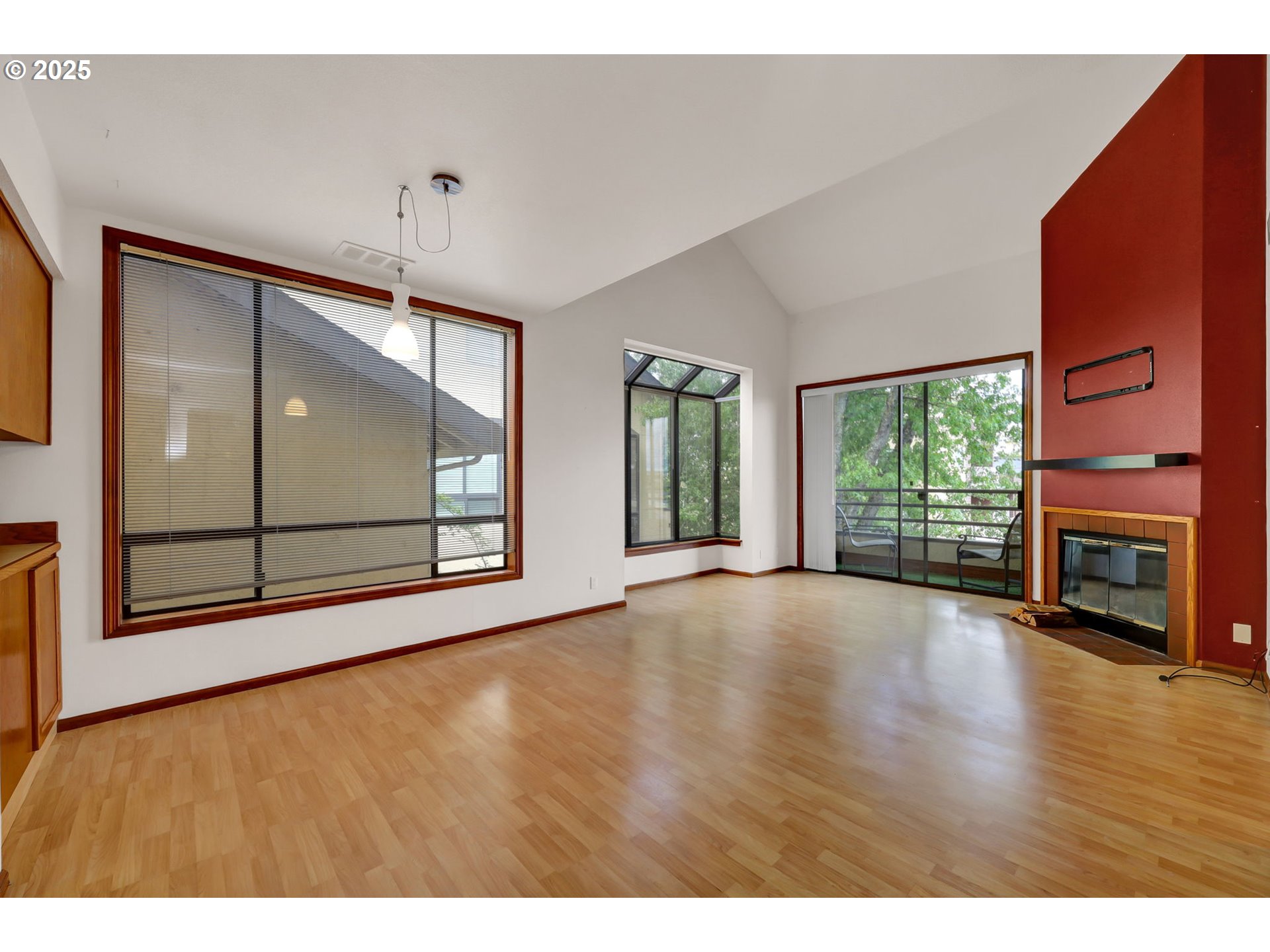 648 Wimbledon Court Eugene, OR 97401 - Photo 9 of 45 a view of an empty room with wooden floor and a window