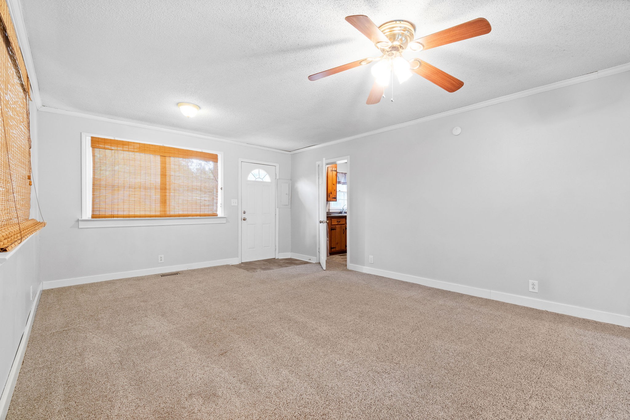 660 Palmyra Road Clarksville, TN 37040 - Photo 11 of 33 an empty room with windows and fan