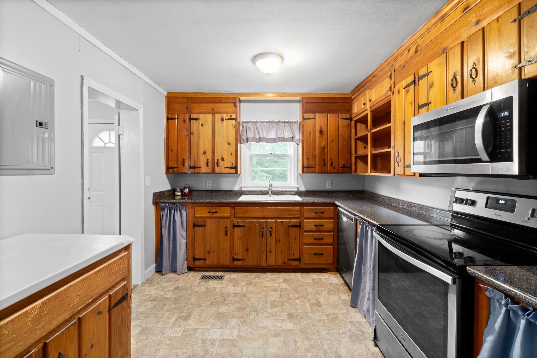 660 Palmyra Road Clarksville, TN 37040 - Photo 13 of 33 a kitchen with stainless steel appliances granite countertop a stove a sink and a microwave