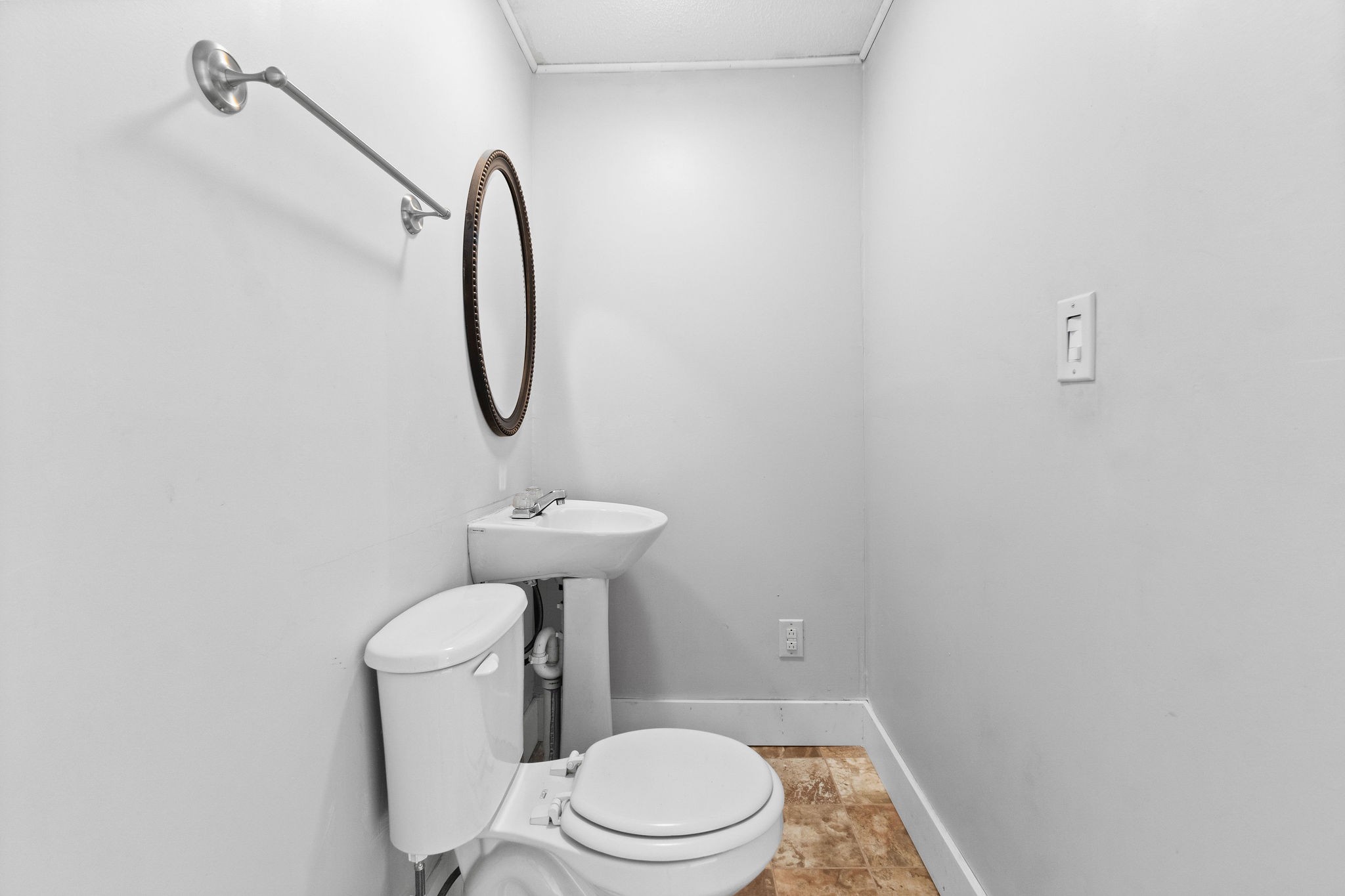 660 Palmyra Road Clarksville, TN 37040 - Photo 18 of 33 a white toilet sitting next to a shower
