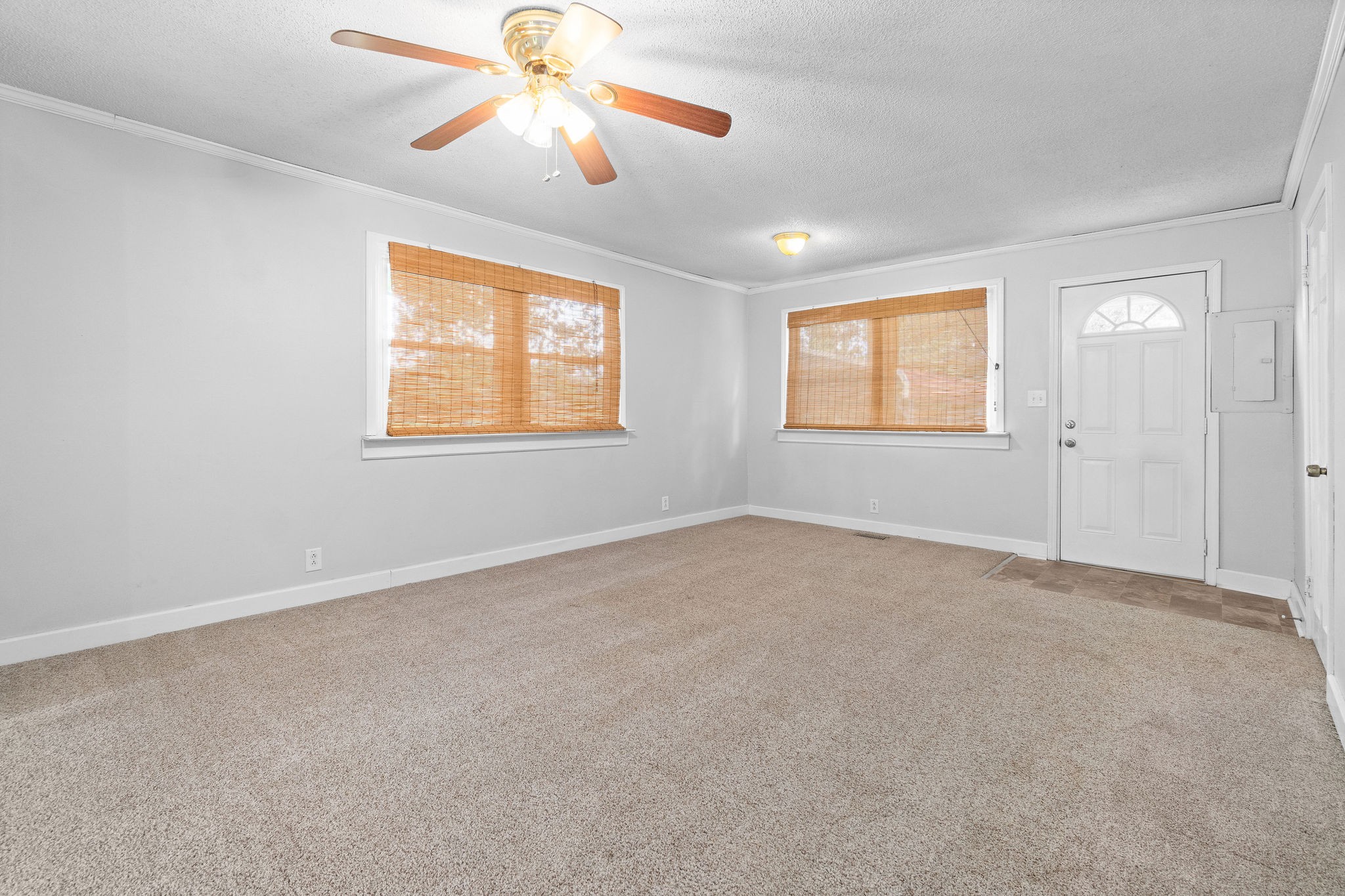660 Palmyra Road Clarksville, TN 37040 - Photo 8 of 33 an empty room with windows and fan