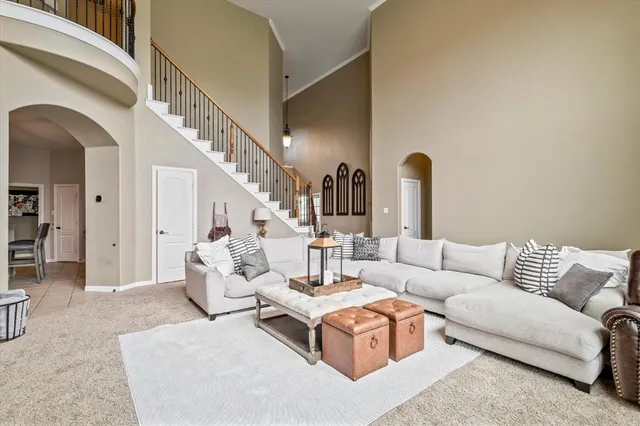 a living room with furniture or couch and a potted plant