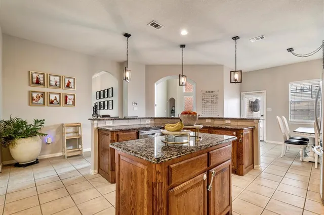 a kitchen that has a lot of cabinets in it