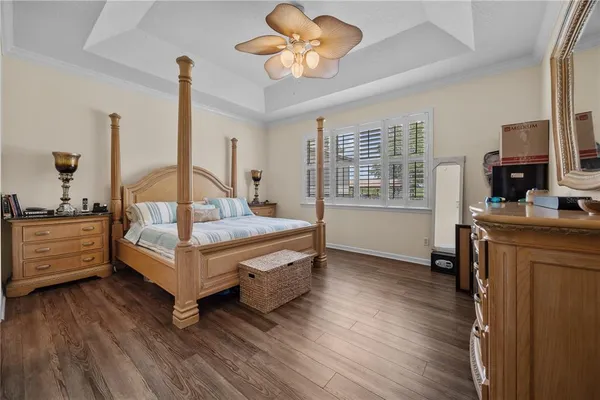 a bedroom with furniture and a window